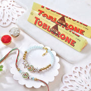 Golden Green Bhaiya Bhabhi Rakhi With Toblerone Chocolates