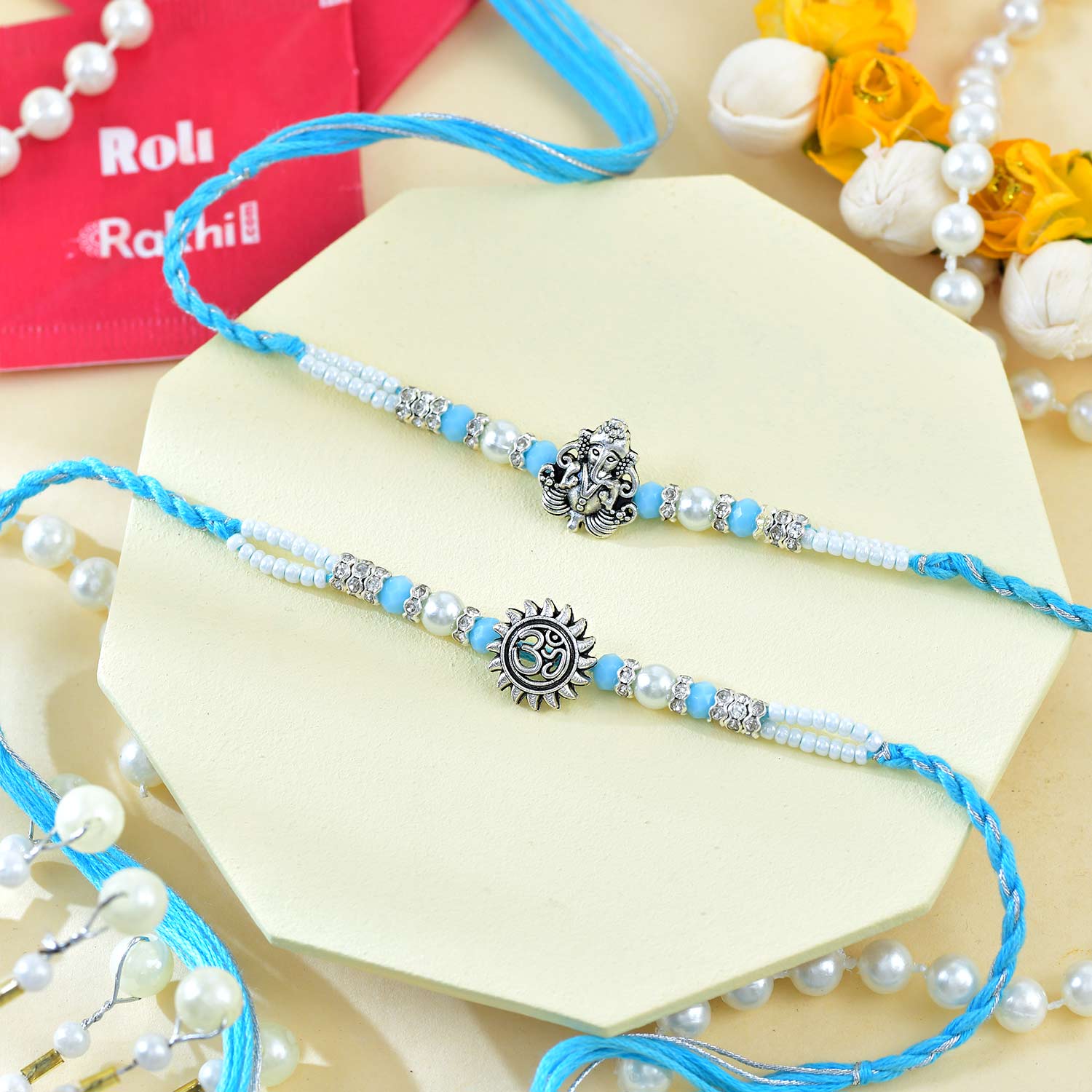 Religious Ganesha And Suriya Dev Rakhi With Kaju Katli