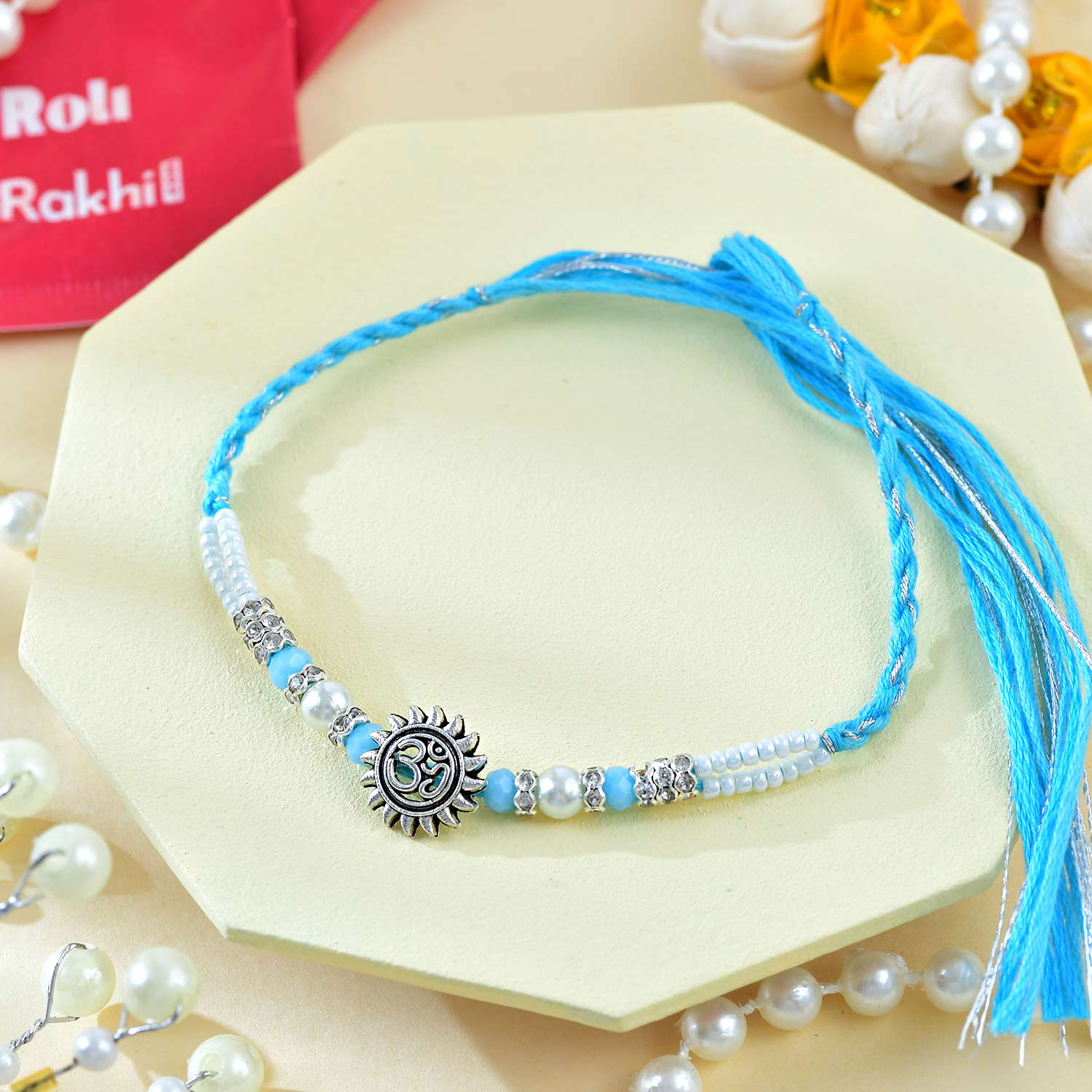 Religious Ganesha And Suriya Dev Rakhi With Kaju Katli