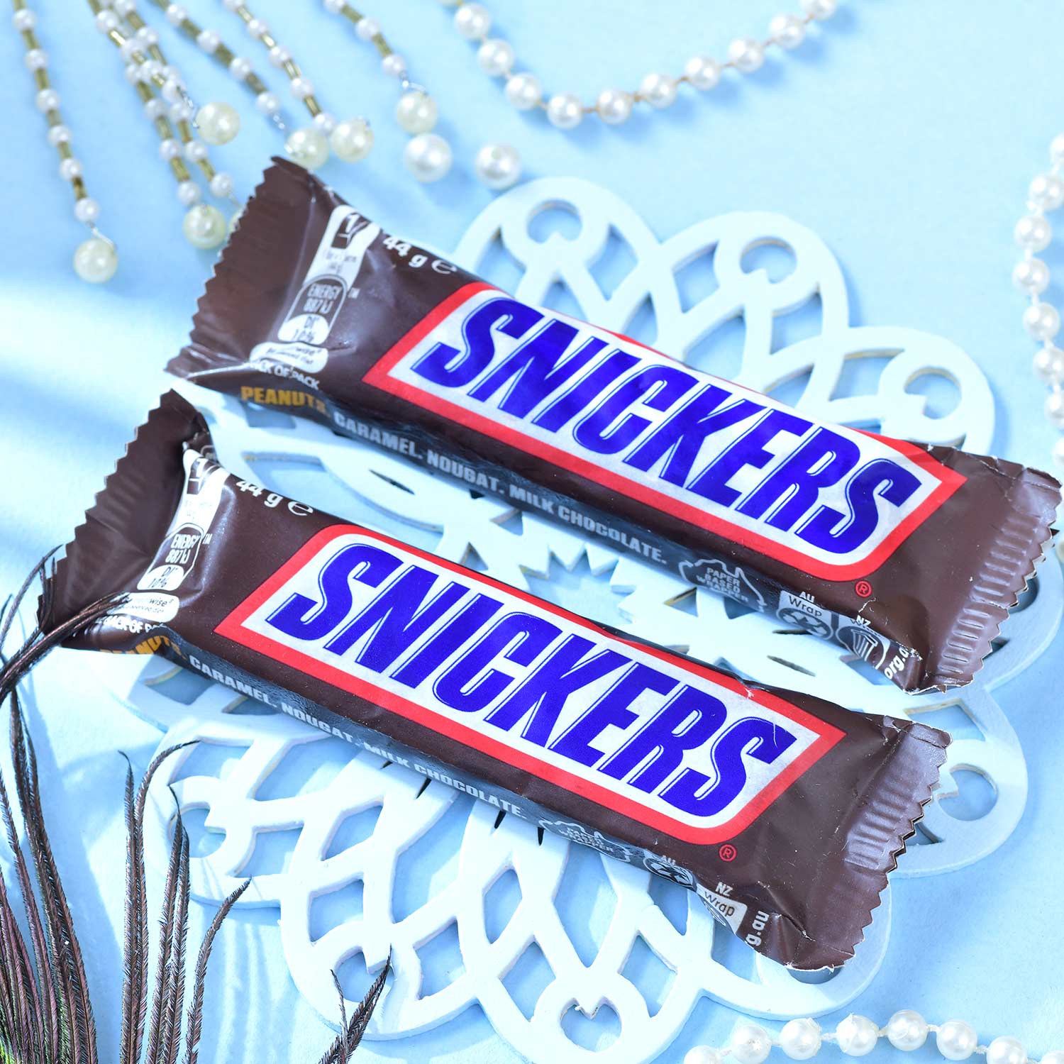 Set Of Three Traditional Rakhi With Besan Laddu & Snickers Chocolates
