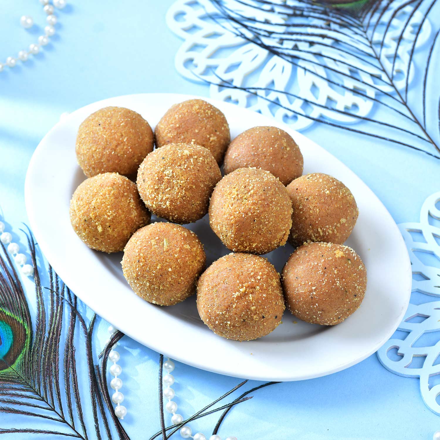 Set Of Three Traditional Rakhi With Besan Laddu & Snickers Chocolates