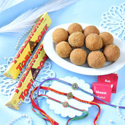 Set Of Three Traditional Rakhi With Besan Laddu & Toblerone Chocolates