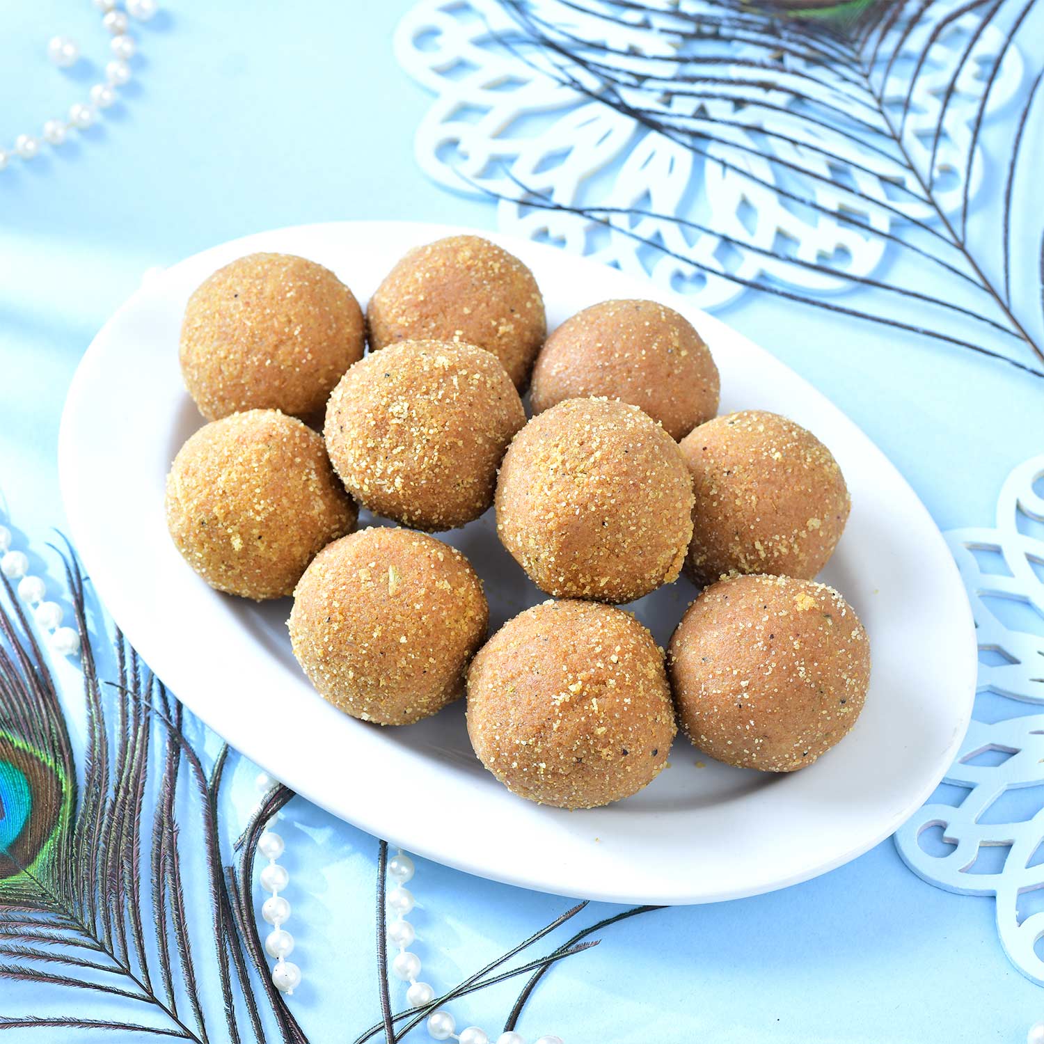 Set Of Three Traditional Rakhi With Besan Laddu & Toblerone Chocolates