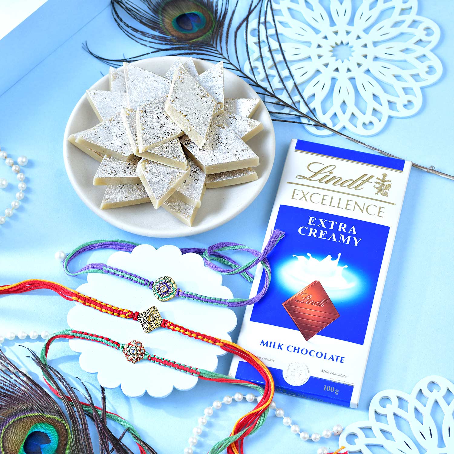 Set Of Three Traditional Rakhi With Kaju Katli And Lindt Chocolate