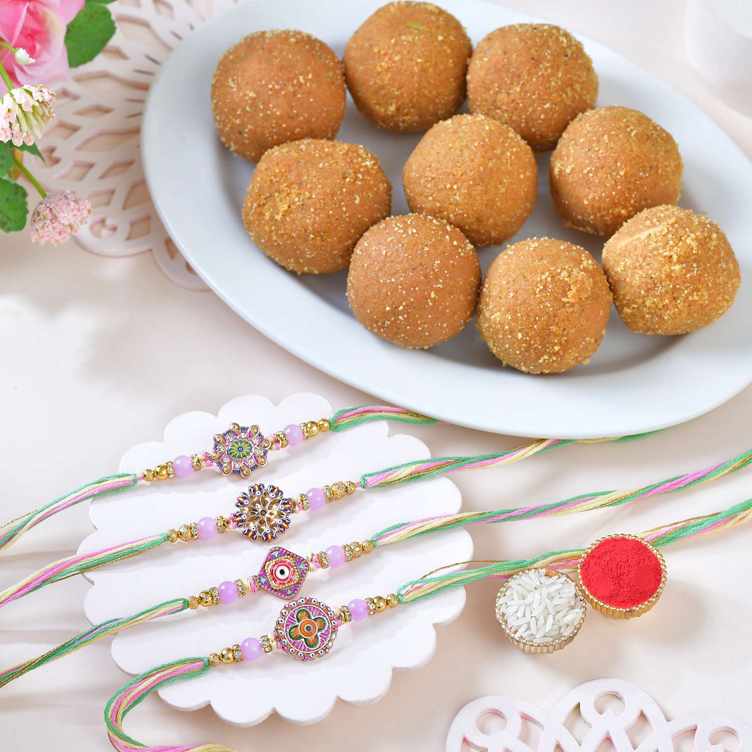 Four Rangoli Rakhi With Besan Laddu